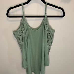 Green shirt with laced open shoulders